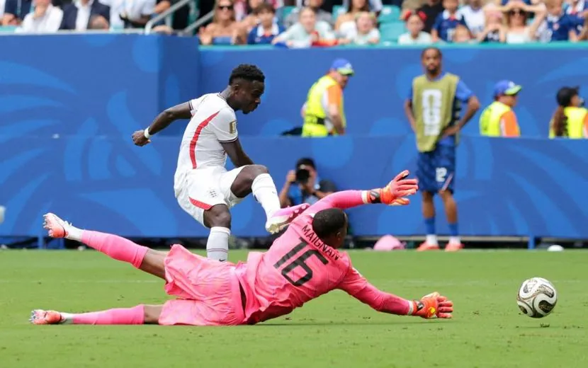 Bukayo Saka fires the ball home for England's fourth goal.