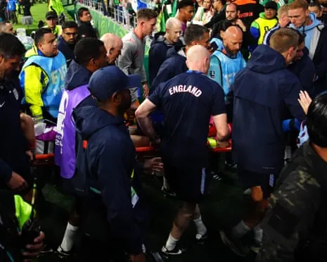 Jordan Henderson is carried off the pitch on a stretcher