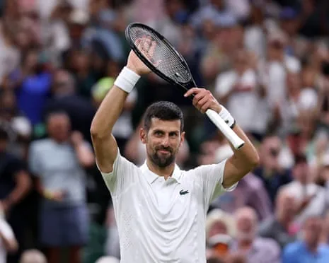 Novak Djokovic acknowledges the crowd following victory over Stefanos Tsitsipas.