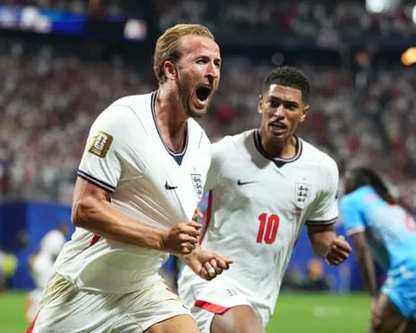 Harry Kane and Jude Bellingham celebrate England's equaliser.