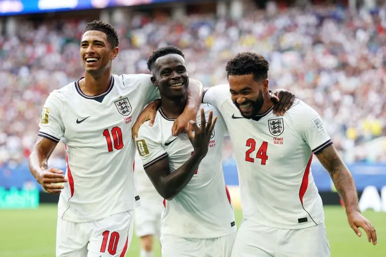 England's Bukayo Saka celebrates scoring their fifth goal to complete a hat-trick with Jude Bellingham and Reece James