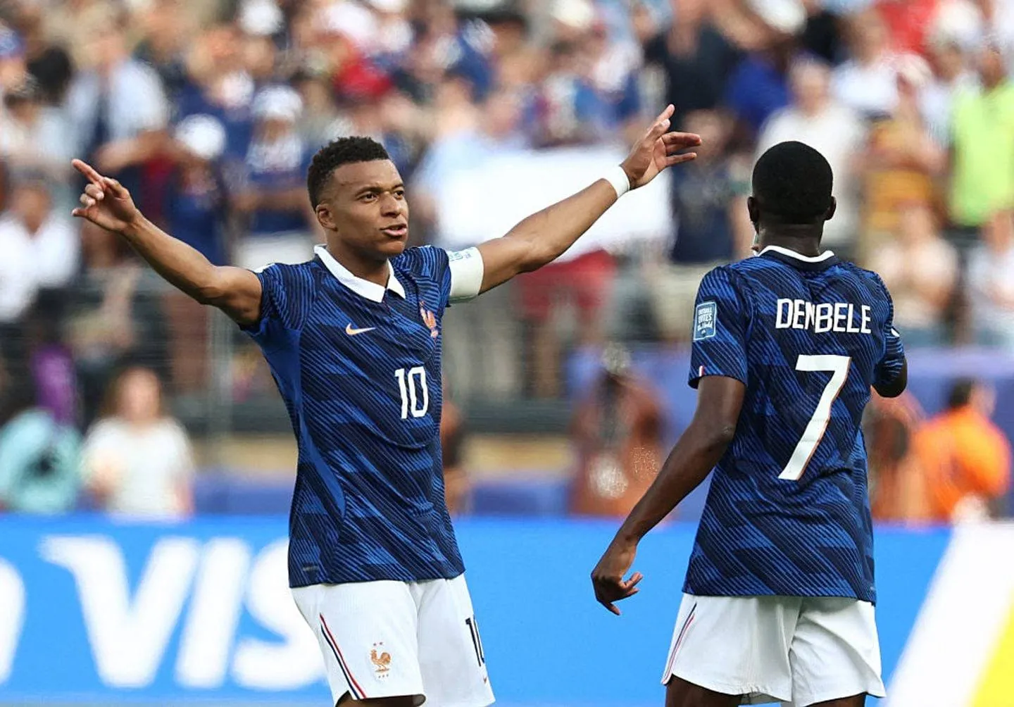 France's forward #10 Kylian Mbappe celebrates scoring his team's first goal with forward #07 Ousmane Dembele during the 2026 World Cup round of 32 football match between France and Sweden at the New York/New Jersey Stadium in East Rutherford on June 30, 2026. (Photo by FRANCK FIFE / AFP via Getty Images)