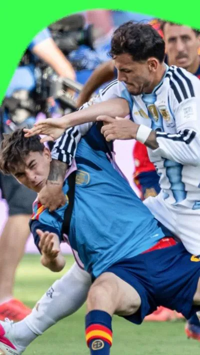 Argentina's Leandro Paredes hits Spain's Gavi